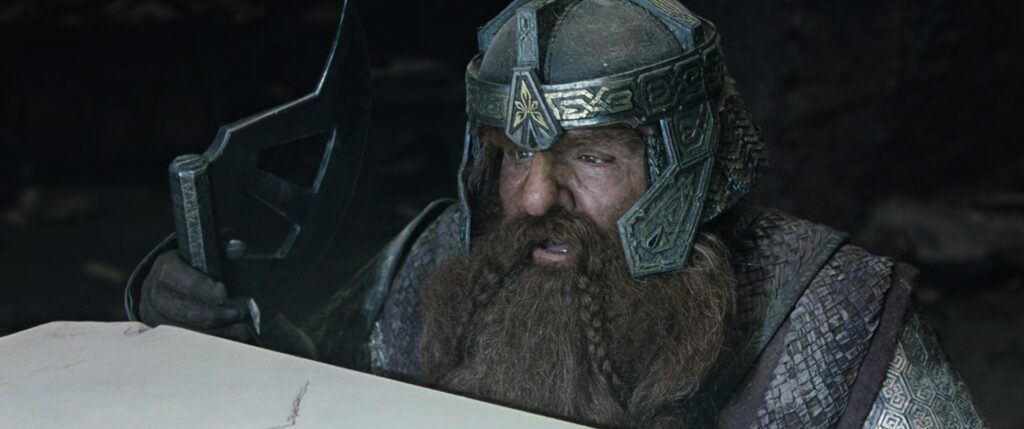 Yüzük Kardeşliği üyesi cüce Gimli baltasıyla Balin'in mezarında.